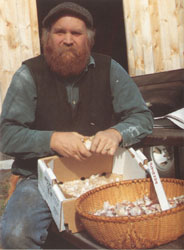 Michael Phillips sits with a basket full of organic garlic grown on Heartsong Farm. Garlic is one of the best ways to make food be your medicine. (photo: Nancy Phillips)